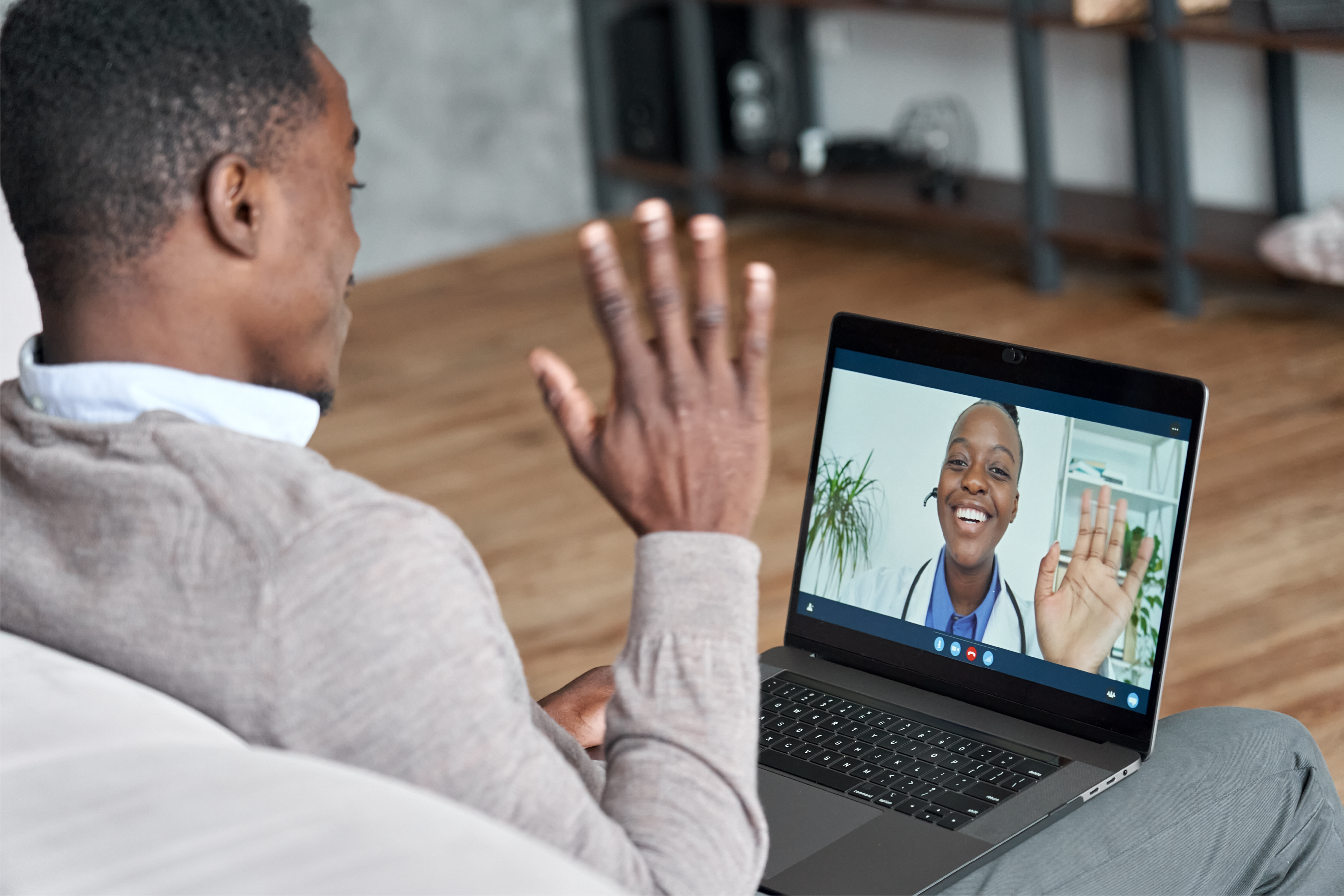 A patient and a physician on a virtual telehealth appointment.
